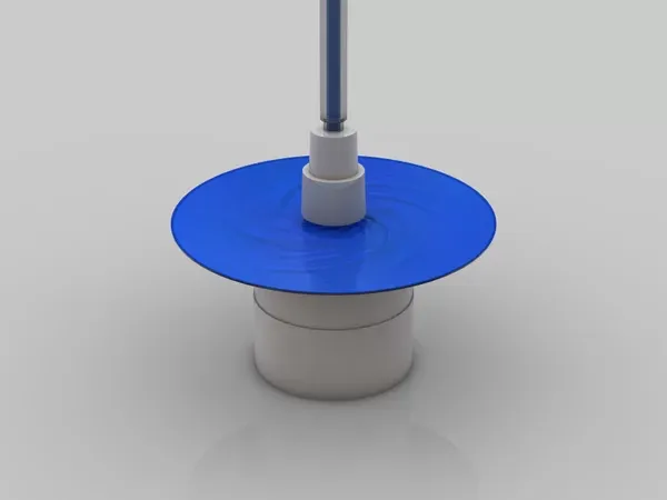 Chất cản quang màu xanh được phủ lên bề mặt wafer thông qua trục quay tốc độ cao